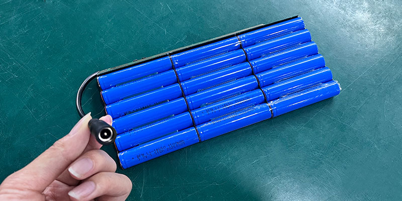 Rechargeable 9Ah battery installed inside promotional backpack powering LED lights