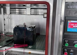 12.8V 40Ah LiFePO4 emergency lighting battery undergoing 100°C high-temperature discharge test at 97.5W for 35 minutes inside a constant-temperature-and-humidity chamber