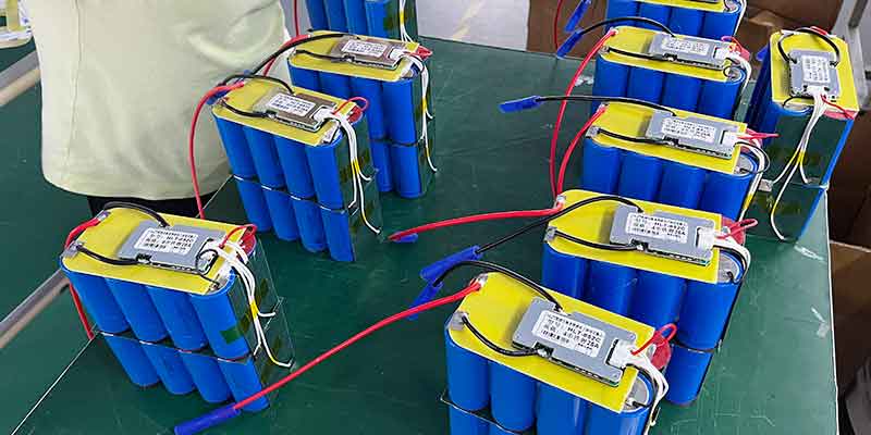 Positive and negative terminal connectors on a 12.8V LiFePO4 solar garden light battery